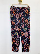 Load image into Gallery viewer, Snake Print Tapered Leg Pull On Pants with Beaded Tassles
