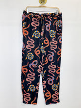 Load image into Gallery viewer, Snake Print Tapered Leg Pull On Pants with Beaded Tassles
